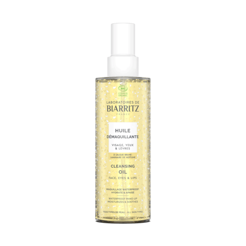 Eine durchsichtige Sprayflasche mit weißem Verschluss, enthält gelbe Reinigungsöl mit Bläschen, gekennzeichnet für Gesichts- und Lippen-Make-up-Entfernung.