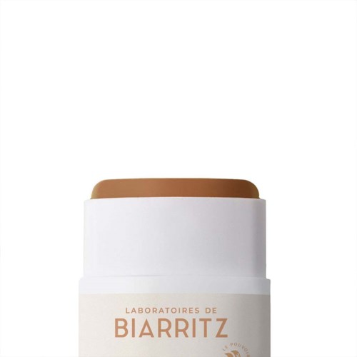A white container with a brown cap and a label that says "Laboratoires de Biarritz".