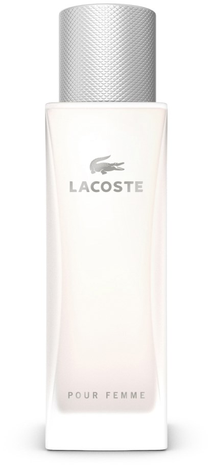 En vit flaska med silverlock, märkt Lacoste Pour Femme, sannolikt innehållande parfym eller lotion.