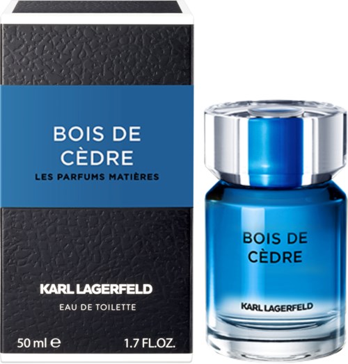 Bildens visar en parfyllflaska och box märkta 'Bois de Cèdre' av Karl Lagerfeld, blå och silverdesign.