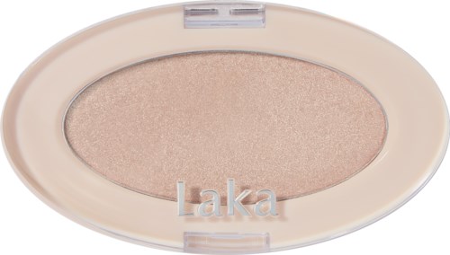 En beige øyenskygge med en blank finish i en oval eske merket 'Laka'.