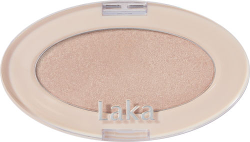 En beige oval sminkkompakt med øyeskygge og ordet "Laka" på.