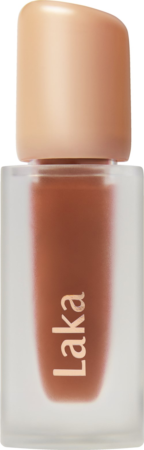 A bottle of nude-colored nail polish with a beige cap, labeled 'Laka' on the front.