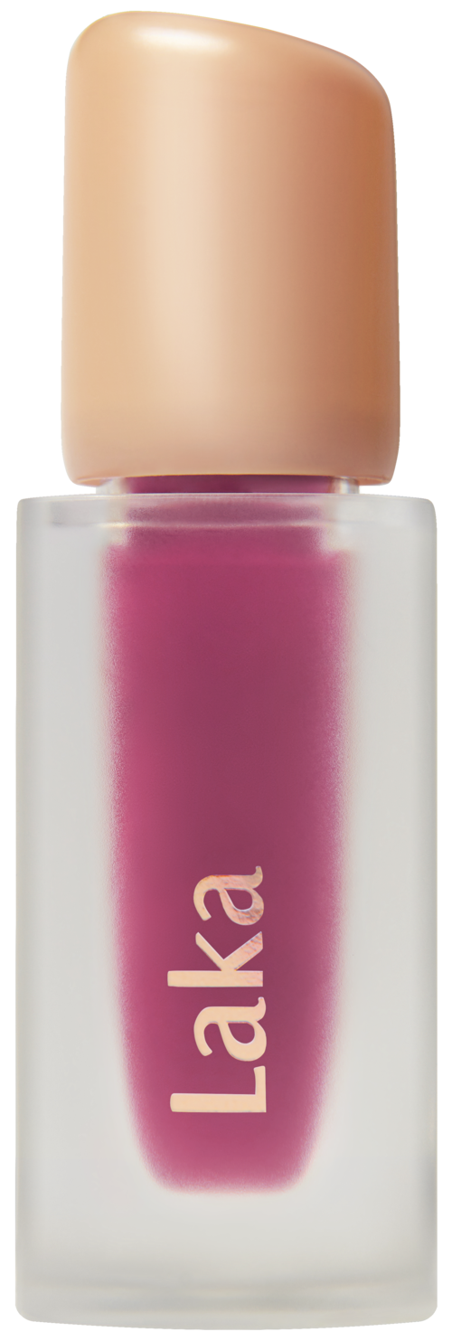 A lipstick tube with a pink-colored liquid inside and a beige cap, labeled 'Ilaka'.