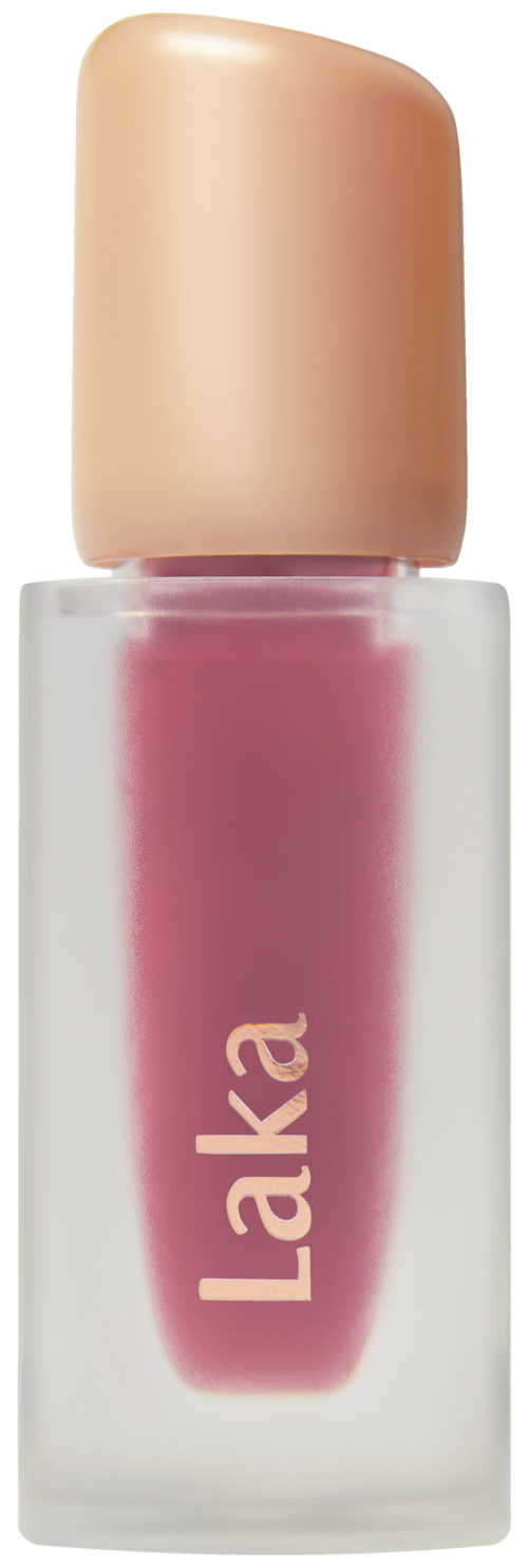 A bottle with pink lipstick and a beige cap, labeled "Laka."