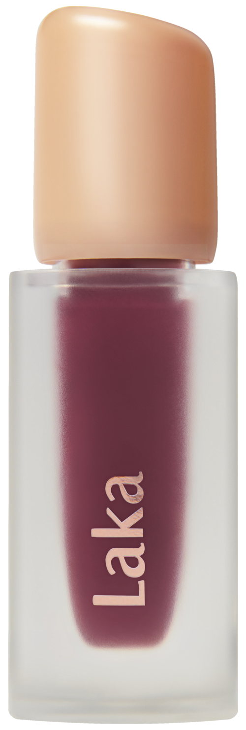 En liten flaske med mørk rosa eller rød leppestift med beige lokk, merket "Laka".