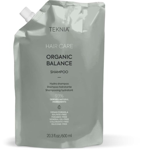 A silver flexible shampoo pouch with black and white text, containing Teknia Organic Balance Shampoo.