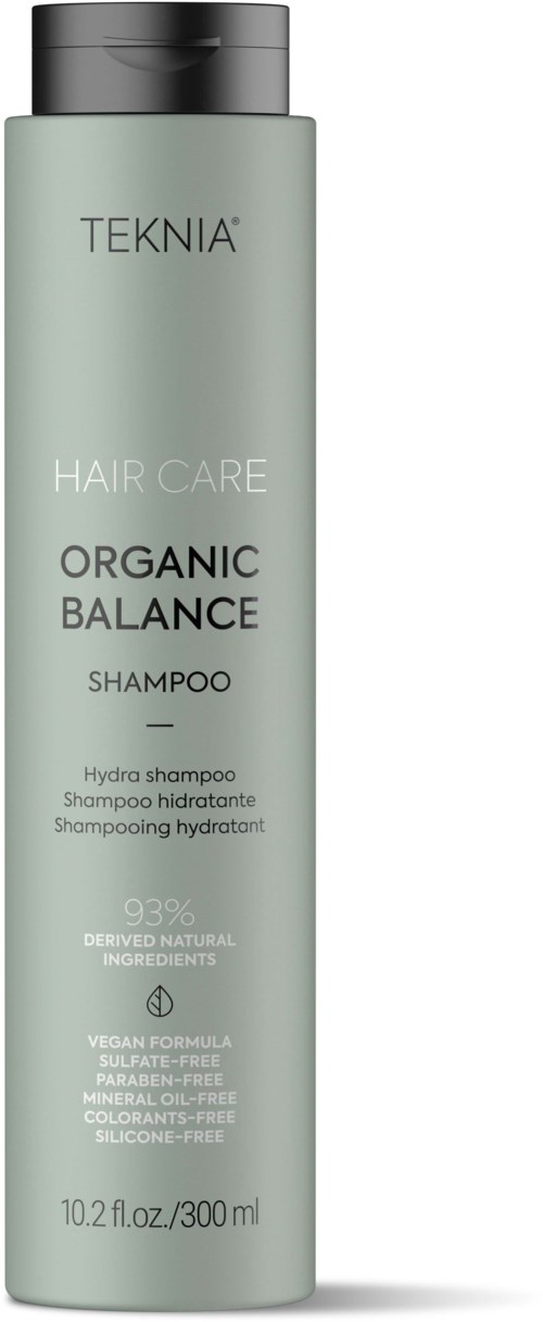 En lang, lys grønn flaske med TEKNIA Organic Balance sjampo med svart hette og produktinformasjon på etiketten.