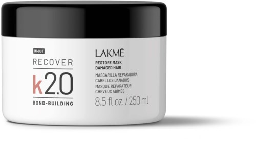 Biały pojemnik z czarną pokrywką, oznaczony Lakme maska do włosów uszkodzonych, 8,5 fl oz lub 250 ml.