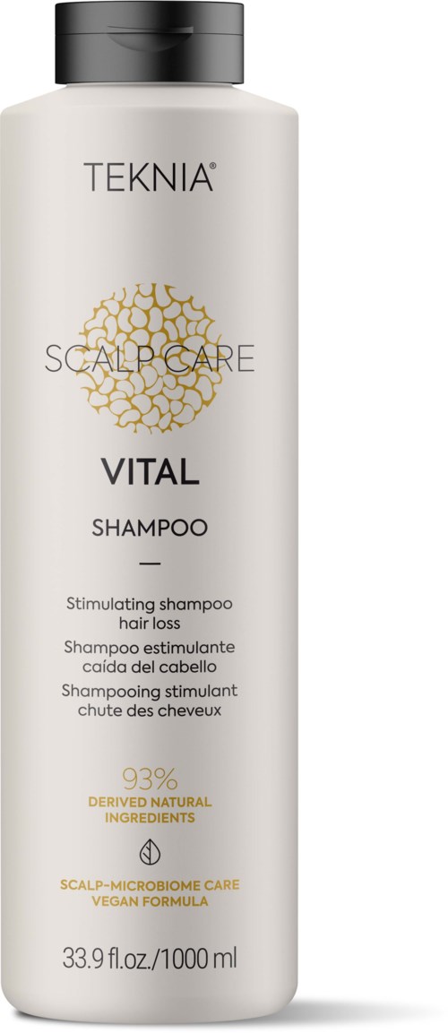 En hvit sjampo-flaske merket 'TEKNIA SCALP CARE VITAL' med svart hette, som fremmer naturlige ingredienser og hodebunnshelse.