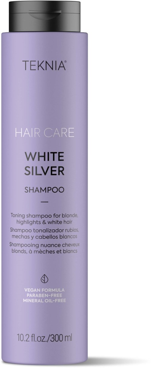 A tall purple shampoo bottle with a black cap, labeled TEKNIA and White Silver, for blond and white hair care.