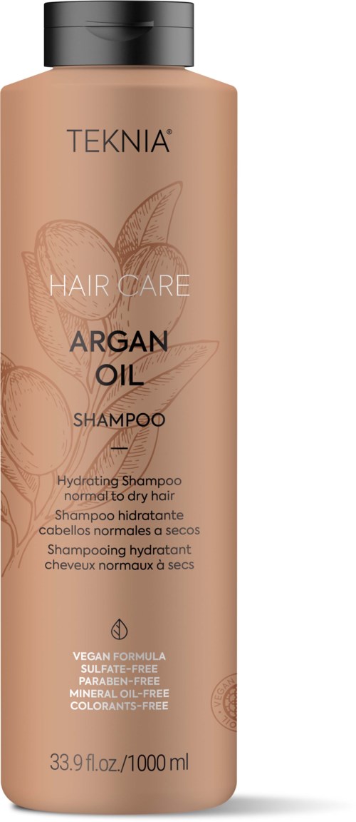 Een lange, beige fles met een zwarte dop, gelabeld 'Teknia Argan Oil Hair Care' en bevat 33,9 fl oz.