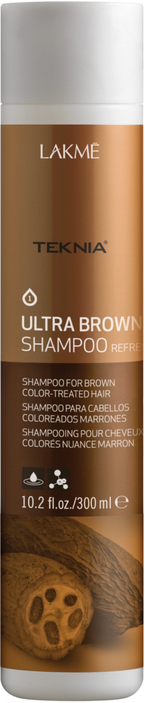 En lång flaska Lakme Teknia Ultra Browning Shampoo för brunt, färgbehandlat hår, med brunt vätska inuti.