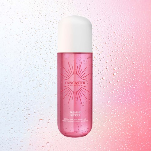 Eine pinke Körpersprühflasche mit weißem Deckel und Sonnenstrahldesign, zu Jasmine Sunset Duft.