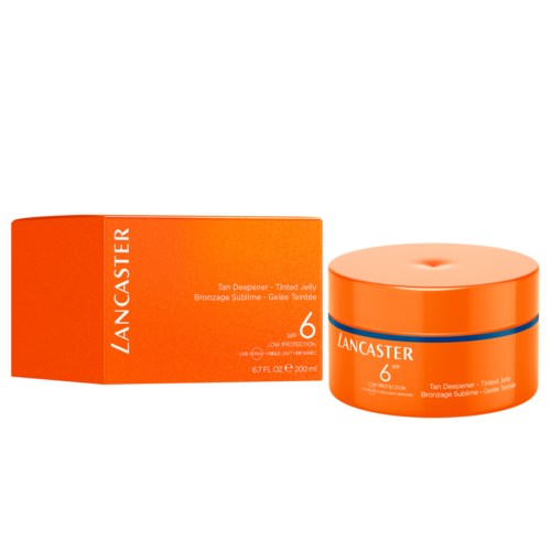 En rund orange beholder med Lancaster-bruning gel ved siden af dens matchende orange æske med produktdetaljer.