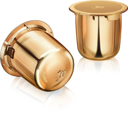 Two shiny, gold-colored containers, one lying down and one upright, with a reflective surface.