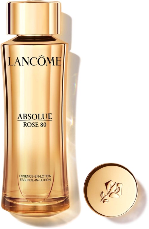 En gyllene flaska med Lancôme Absolue Rose 80-lotion och en matchande lock bredvid.