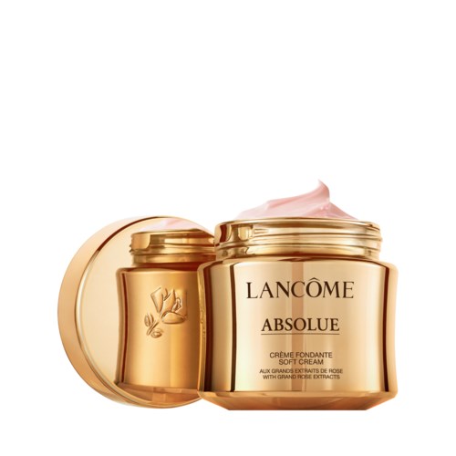 En guldfärgad burk med Lancme Absolue mjuk kräm med rosa kräm ovanpå.