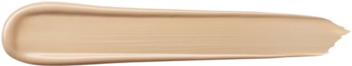 Ett beige kosmetikprodukt är utbrett i en lång, tunn linje med en lätt kurva på svart bakgrund.