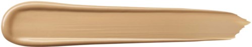 En beige makeupbørste med rund ende, der viser en stribe af foundation eller concealer.
