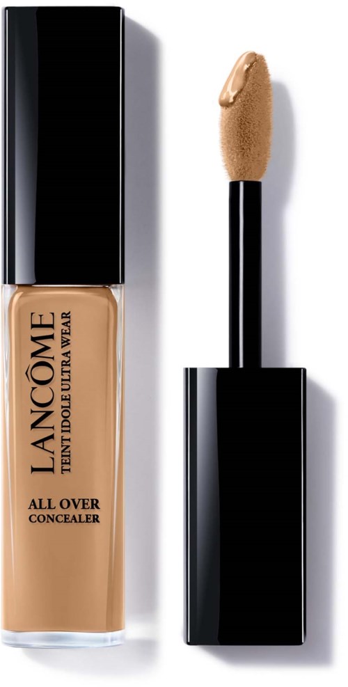 En flaska Lancôme-blemkniv med applikator, märkt "All Over Concealer," beige färg, svart lock.