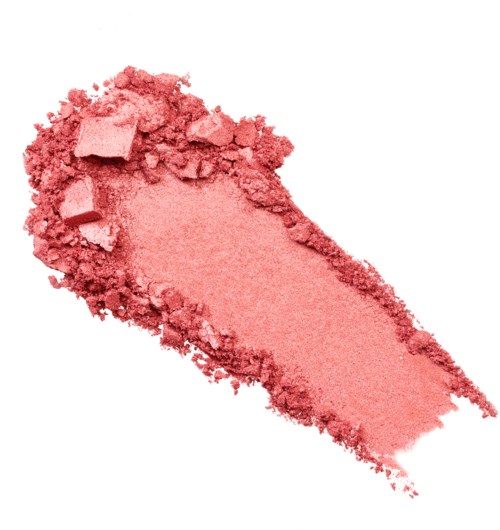 Rosa löspuder med några klumpar och ett jämnt lager, troligen smink eller rouge.