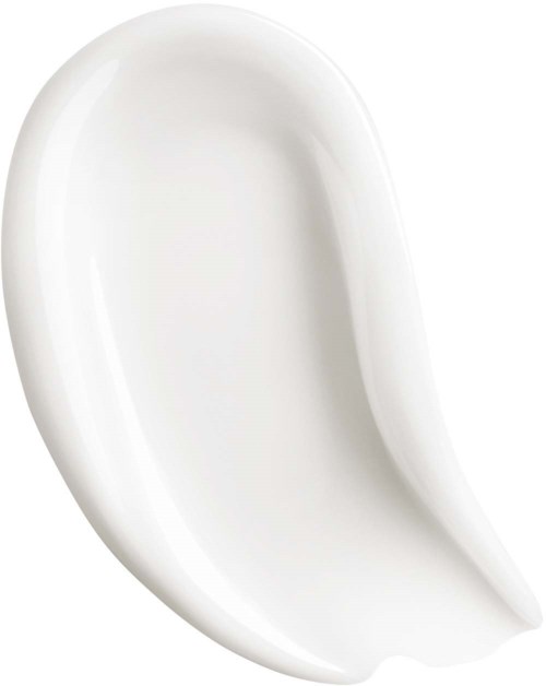 A white ceramic dish with a curved, shell-like shape and smooth surface.