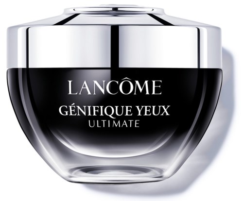 A luxury eye cream container with a shiny silver lid and black jar, labeled 'LANCOME GÉNIFIQUE YEUX ULTIMATE.'
