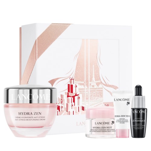 Ett hudvårds-presentset med krämer, serum och en liten burk, alla från Lancome, i ljusrosa förpackning.