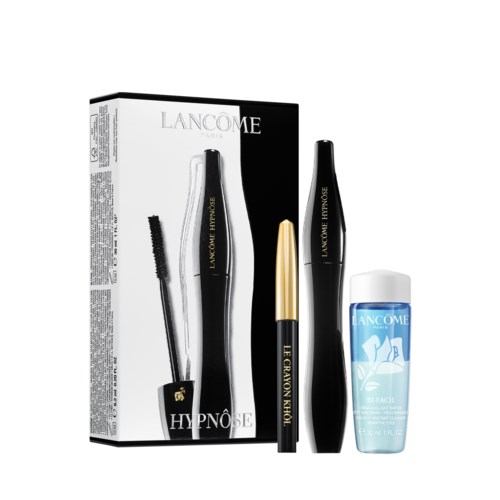 En set Lancôme Hypnôse mascara och ögonprodukter med vit box, svart tub, guldlock och blå hudvårdsprov.