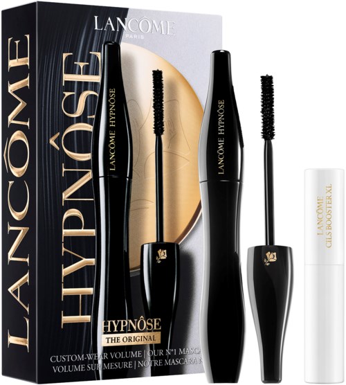 Zwei schwarze Mascara-Röhrchen mit Bürsten, ein weißes Mascara-Röhrchen, und eine Schachtel mit Gold- und Schwarzd Design.