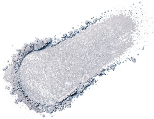 A white powdery substance is spread out with some shaping and small scattered particles around.