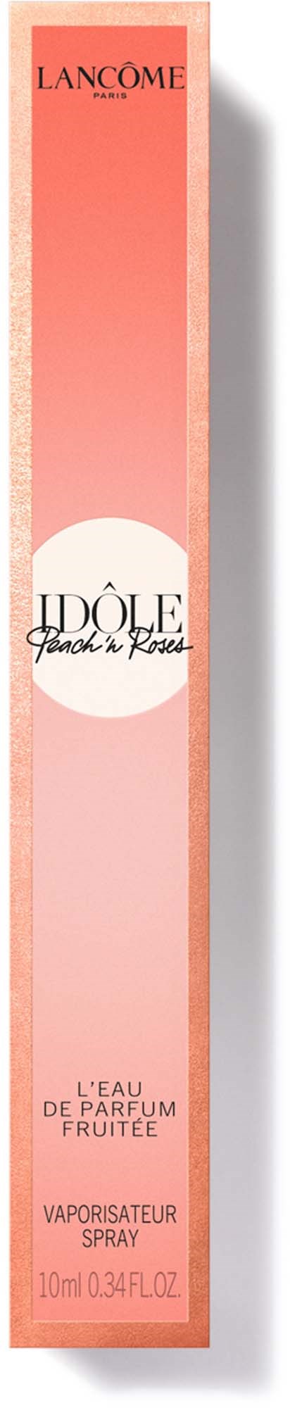 A tall, pink perfume box with black and white text, indicating a fragrance named 'Idôle' by Lancôme, and describing it as fruity.