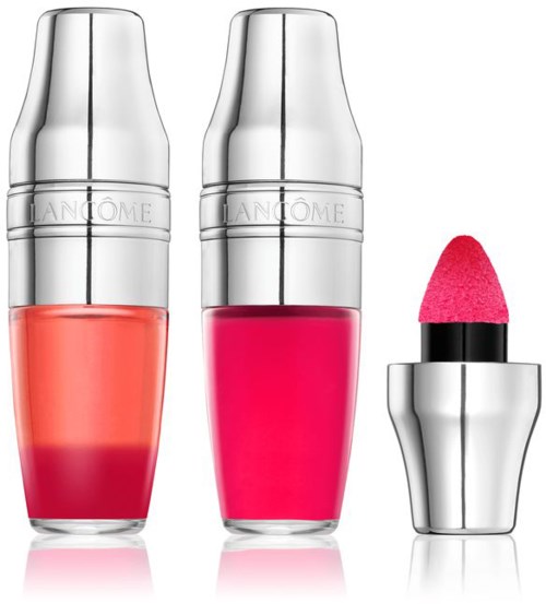 Tre Lancôme-läpprodukter med silverlock, två i glasflaskor och en med en rosa svampapplikator.