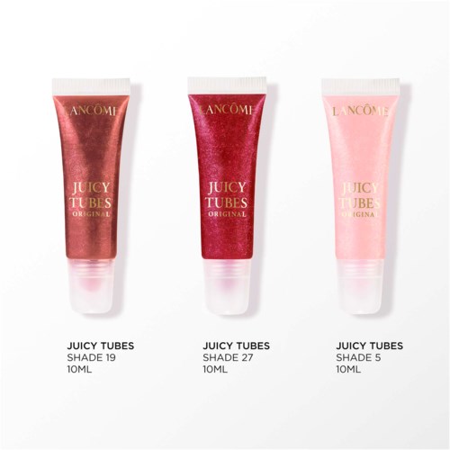 Tre tuber av Lancôme Juicy Tubes läppglans i olika nyanser av rosa och rött.