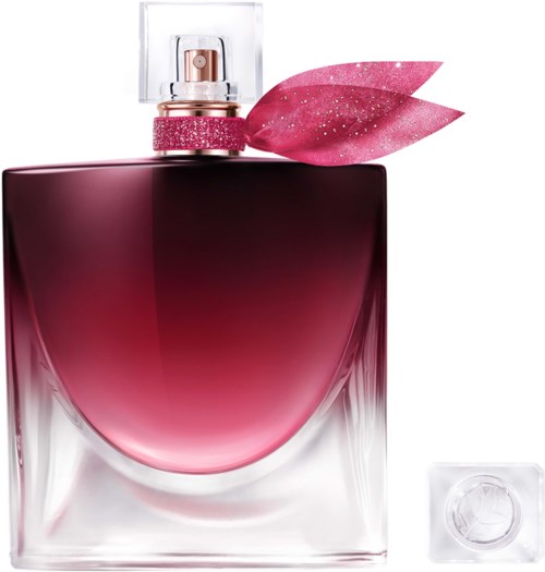 Ein Parfümflakon mit rosa Farbverlauf, dekorative pinke Blätter oben und klaren Glas mit quadratischer Form.