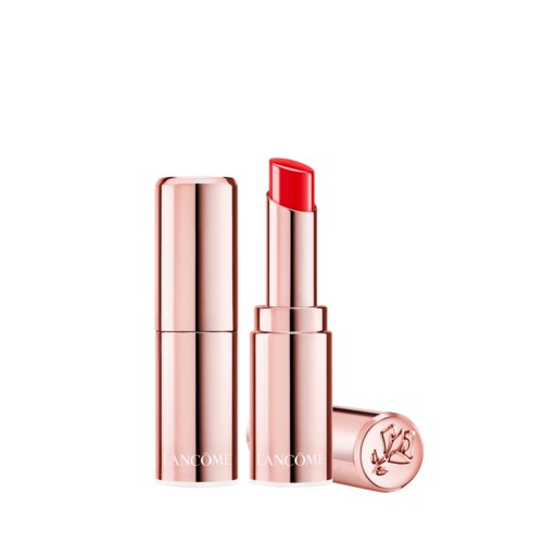 Ett roséguld läppstift med delvis utsträckt röd läppstift. Locken är avlägsnad.