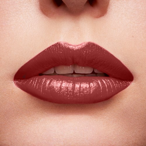 Close-up of lips with shiny red lipstick, showing teeth slightly between lips.