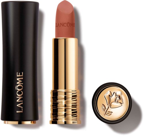 A lipstick with a black and gold case, pink lipstick inside, and a gold lid with a floral design.