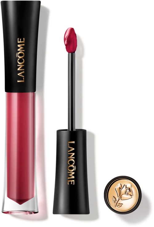 Lippenbalsemtube met zwarte dop, roze vloeistof binnenin, en een kwastje. Kleine ronde doos met beige bloemendessin.