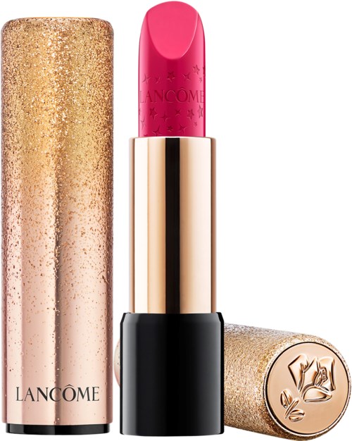 A pink lipstick in a black and gold tube, with a glittery gold cap and floral design on the top.