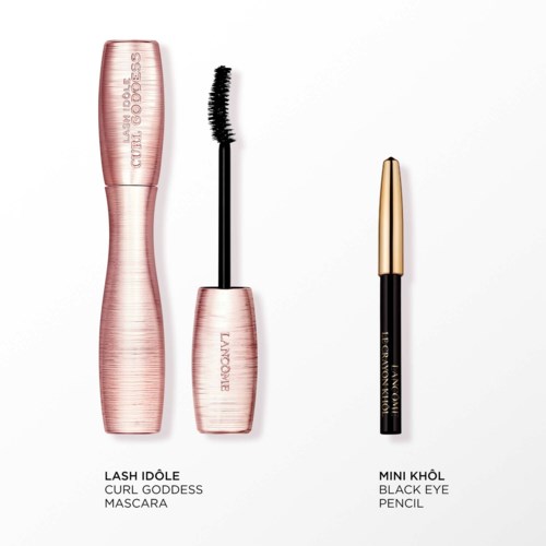 Rosa mascara-förpackning med borste och svart ögonpennor med guldlock, mot vit bakgrund.