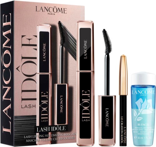 Et Lancôme mascara-set med fire elementer, inkludert mascara-rør, en gullkremt applikator og en liten ansiktsrensemiddel.