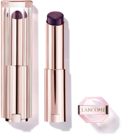 A rose gold lipstick case and a purple lipstick with a Lancôme label. The case is shiny and reflective.