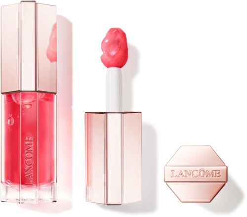 A lip gloss tube with pink liquid, a lipstick with a pink tip, and a hexagonal compact labeled 'LANCOME.'