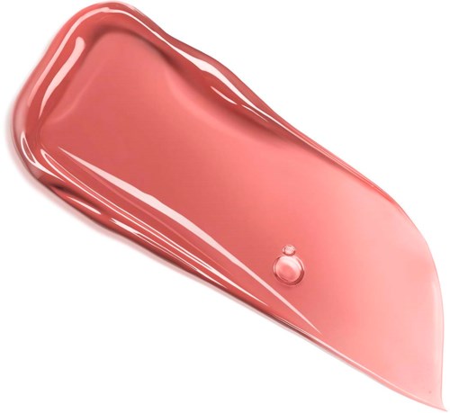 A drop of pinkish lip gloss or liquid sits on a clear surface. It has a shiny, smooth appearance.