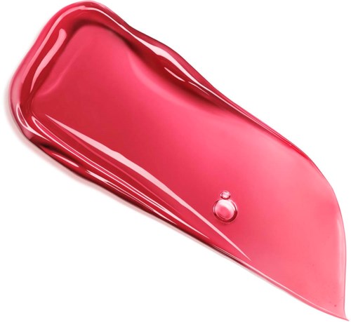 A pinkish-red liquid with a shiny surface is spread on a white background, showing a smooth, curved shape.