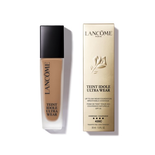 En flaska Lancôme flytande foundation bredvid dess förpackning, märkt Teint Idole Ultra Wear, med SPF 35.
