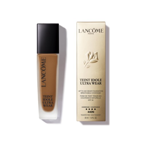 Butelka podkładu Lancôme i jej opakowanie, oba w kolorze beżowym i czarnym, z informacjami tekstowymi.