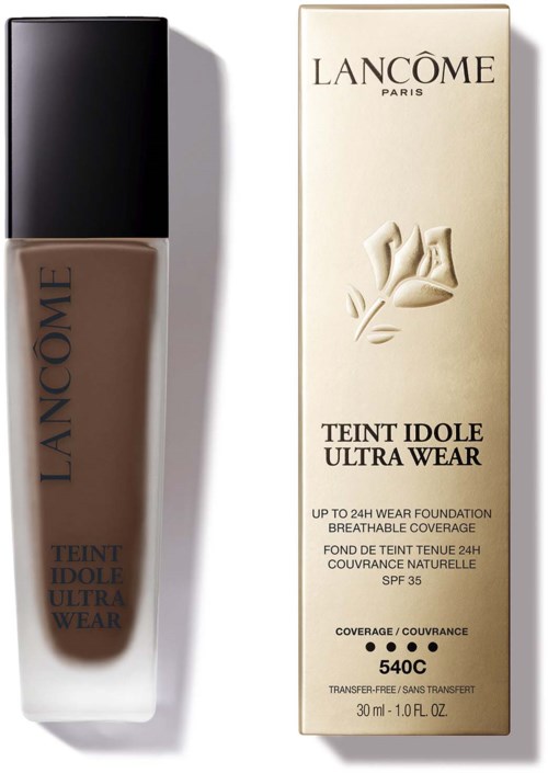 Lancôme Teint Idole Ultra Wear foundation och dess förpackning visas, med en brun flaska och beige förpackning.